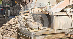 Man cutting a stone with a water saw