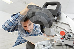 man cutting wood with circular saw