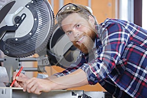 man cutting wood with circular saw