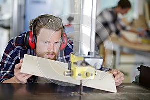 man cutting wood with milling machine