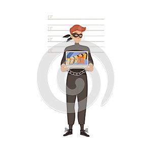 Man Cybercriminal Wearing Black Mask and Shackles Committing Network and Computer Crime Harming Security and Financial