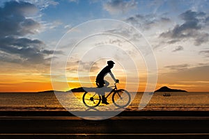 Man cycling at beach