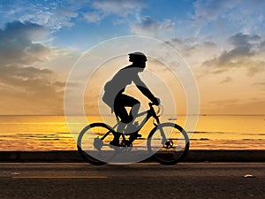 Man cycling at beach