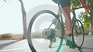 Man cycling on road bike outdoor exercise on an empty road in the morning .Extreme sport concept. close - up, slow