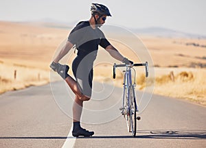 Man, cyclist and stretching on road with bicycle in fitness, training or outdoor sports in countryside. Active male