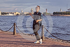 Man is dancing near Neva river