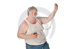 Man dancing to music on handheld audio device