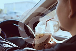 Man is dangerously drinking cup of cold coffee photo