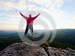 Man dangerously jumping on the edge. Man jump. Young man falling down photo