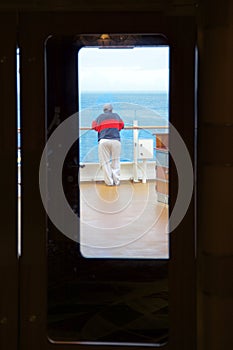 Man on deck of cruise ship