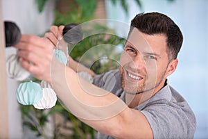 man decorating house