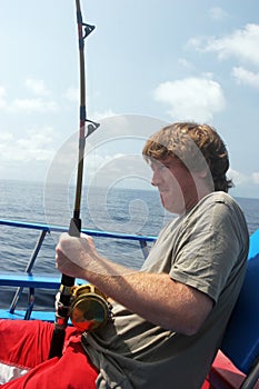 Man deep sea fishing