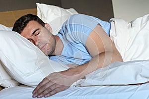 Man deeply sleeping in comfy bed