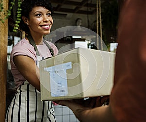 Man Deliver Mail Box to Woman in front of Stop