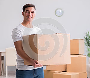 Man delivering heavy boxes at home