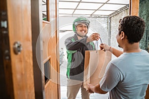 Man delivery service uber send shopping bag