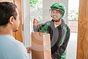 Man delivery service uber send shopping bag