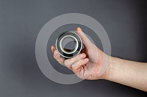 A man demonstrates Hub bearing against a gray background. New Me