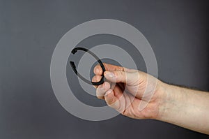 A man demonstrates Locking Ring against a gray background. New M