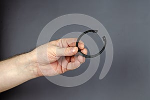 A man demonstrates Locking Ring against a gray background. New M