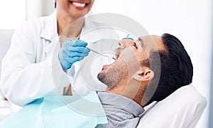 Man, dentist and check teeth with tools for dental cosmetics, healthcare assessment or medical consulting. Patient