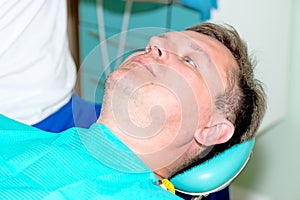 Man in dentist office waiting for procedure