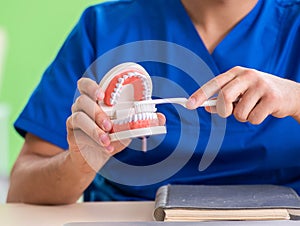 Man dentist working on new teeth implant