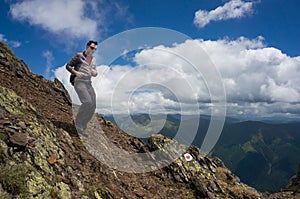 Man descending in the mountains