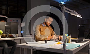 Man or designer with computer and tablet at office