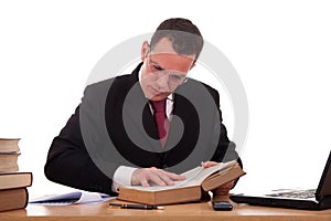 Man on desk reading and studying