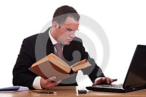 Man on desk reading and studying,