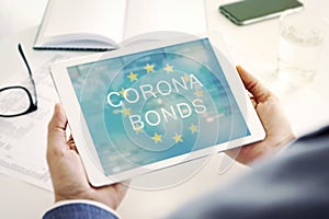 Man at a desk and text corona bonds in a tablet