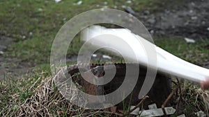 Man destroying keyboard against a stone close-up. Violence, outburst, anger. Keyboard shatters into small pieces.slow