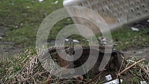 Man destroying keyboard against a stone close-up. Violence, outburst, anger. Keyboard shatters into small pieces.slow