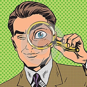 The man is a detective looking through magnifying