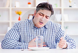 Man on diet waiting for food in restaurant