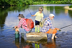 Man in different ages. Father and son fishing. Happy fisherman with fishing rod. Hobby and sport activity. Anglers.