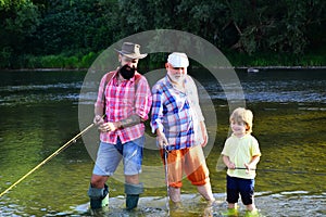 Man in different ages. Father and son fishing. Happy fisherman with fishing rod. Hobby and sport activity. Anglers.