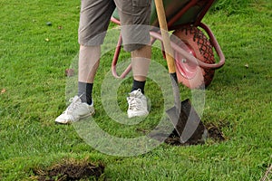 Man digging a hole with a shovel