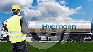 Man with digital tablet on a background of hydrogen tank trailer