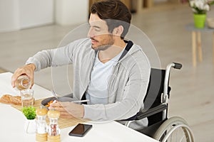 man disable having lunch