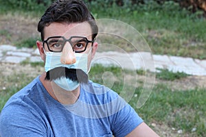 Man in disguise wearing protective mask