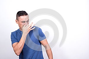 Man disgusted by bad smell photo