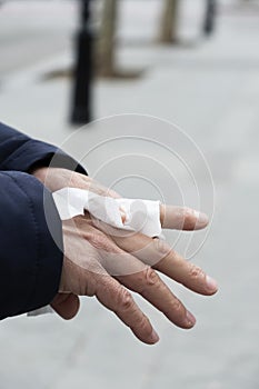 Man disinfecting his hands with a wet wipe