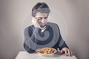 Man disliking food