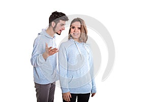 Man disputing with smiling woman, couple isolated