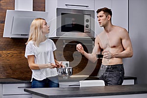 Man dissatisfied with what his wife is cooking