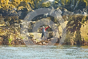 Man diver without a hand set out to dive near island