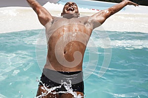 Man Diving Backward Into Swimming Pool