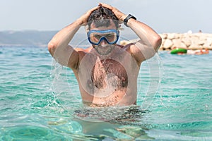 Man with diving mask in the sea